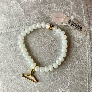 POSHERS! Chavez for Charity white stretch bracelet with hanger. So cute!